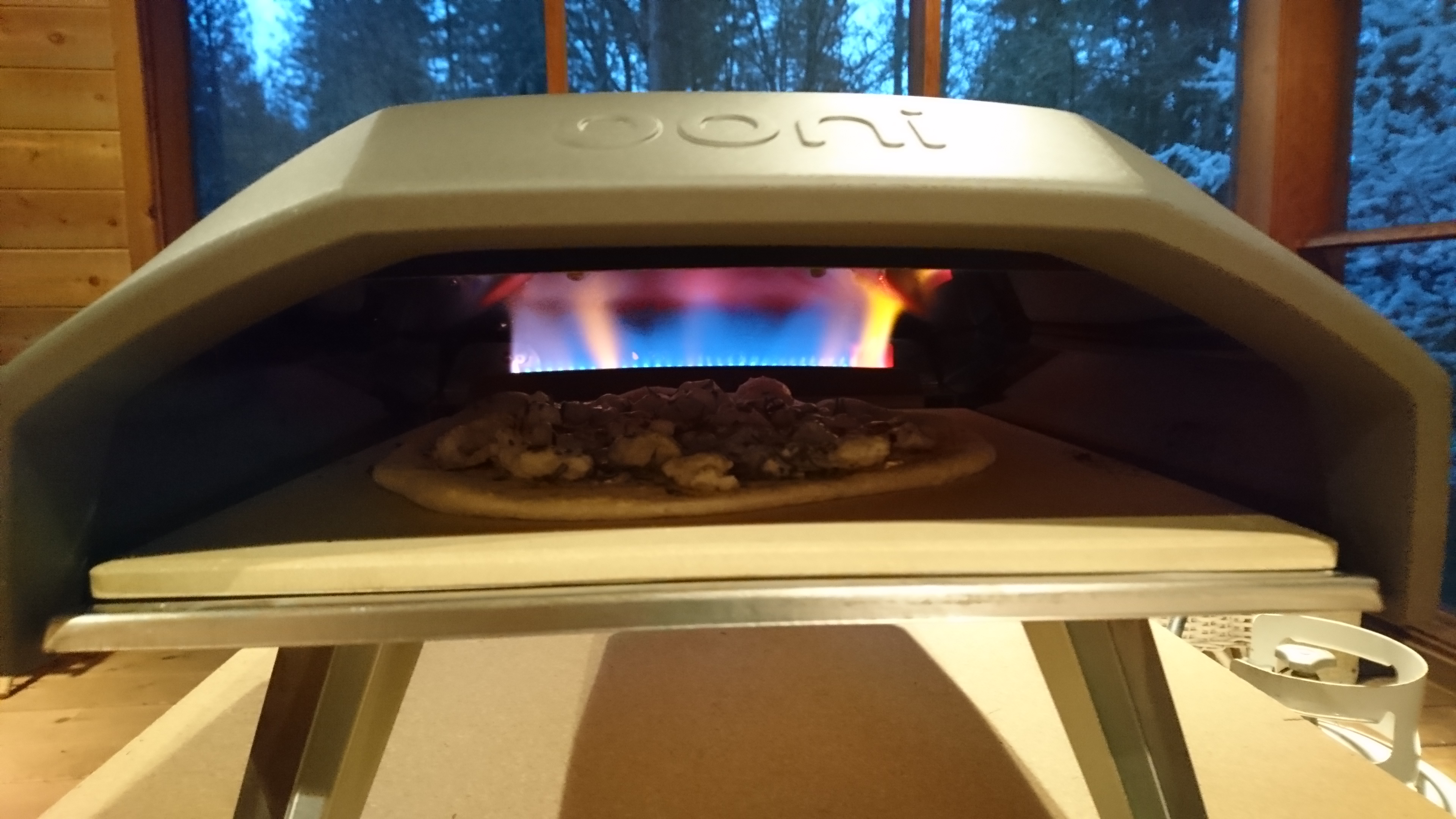 pizza baking inside pizza oven