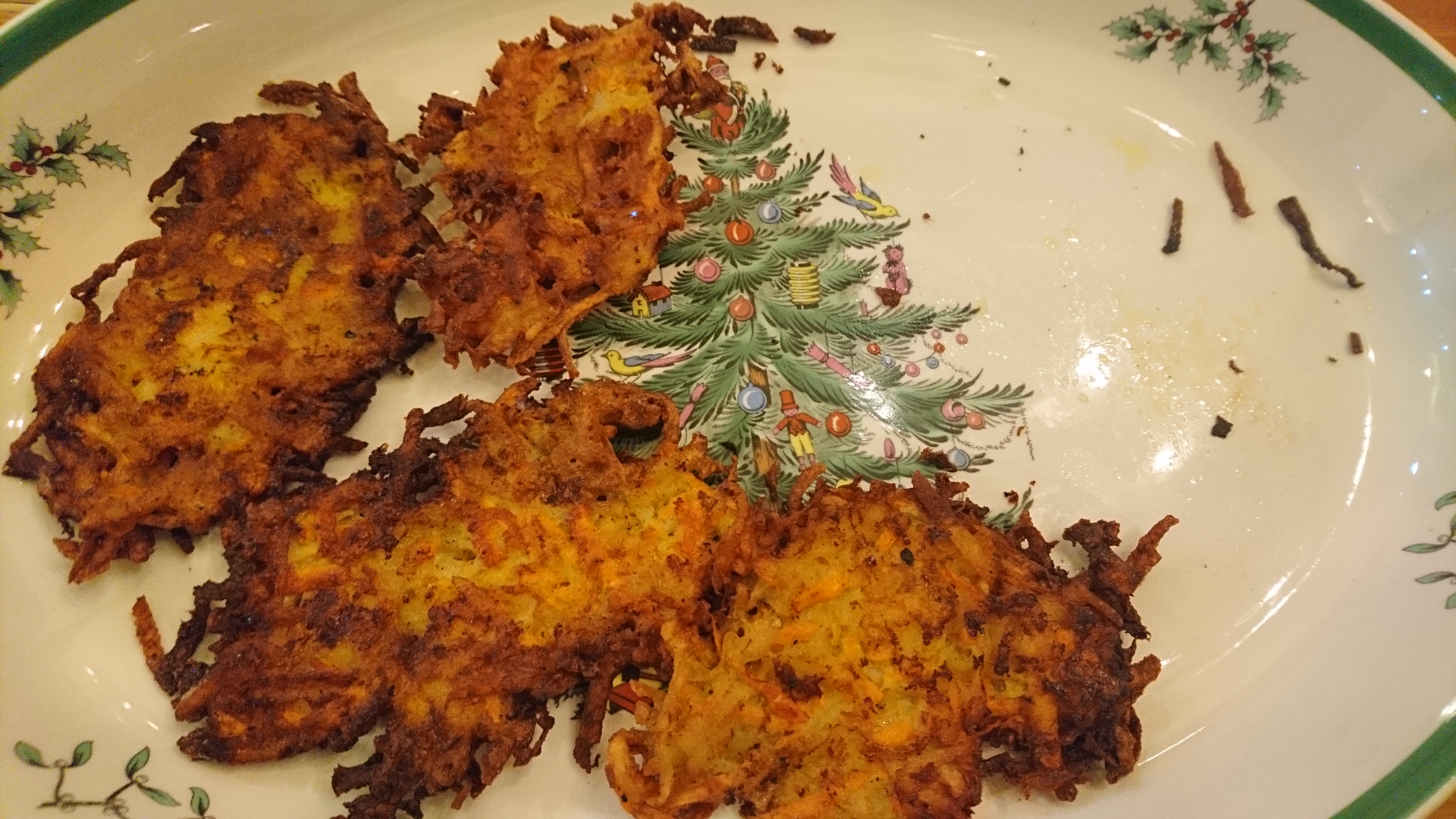 four latkes on a chrismas platter