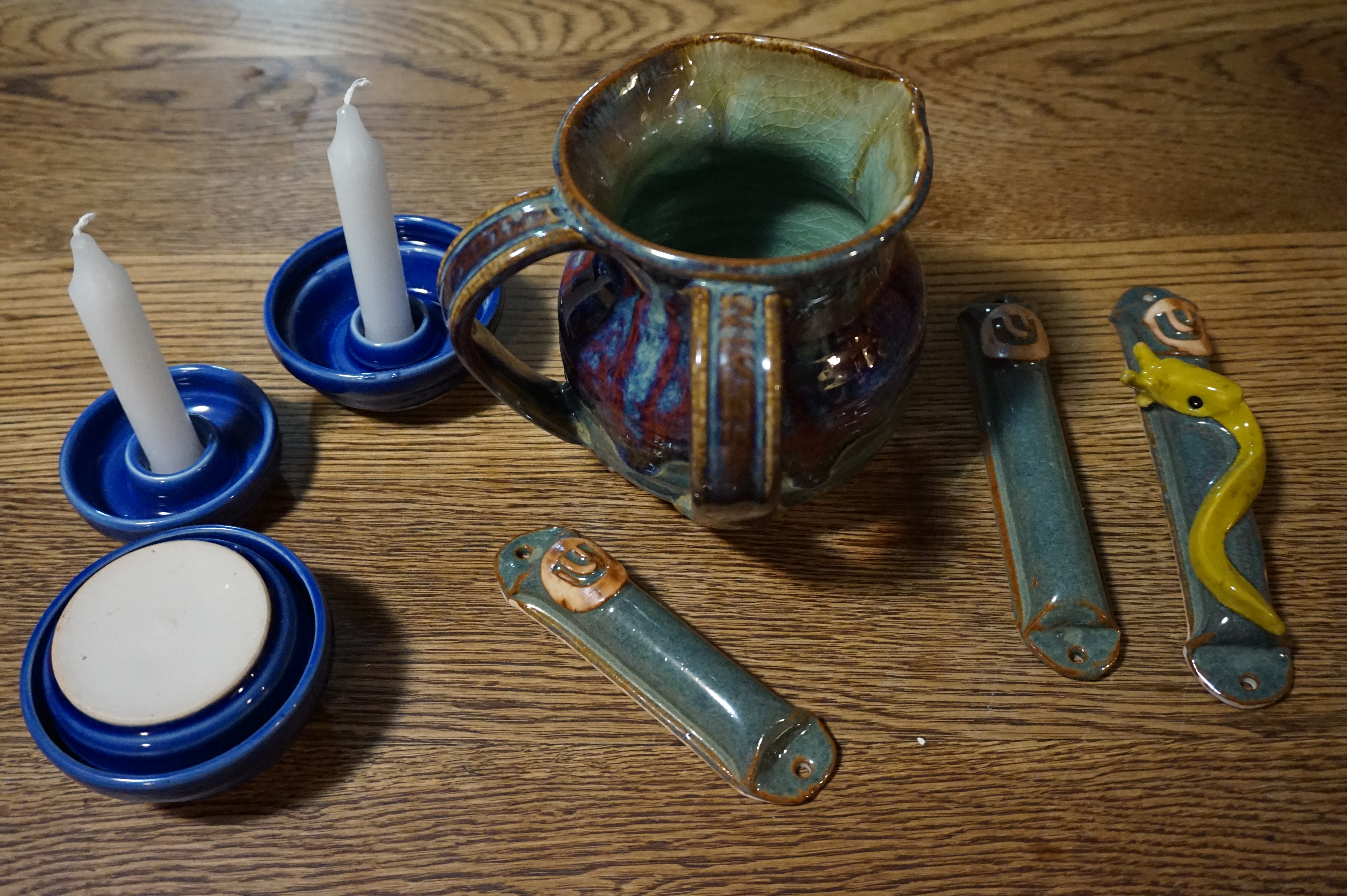 photo of candle holders, mezuzzot, hand washer