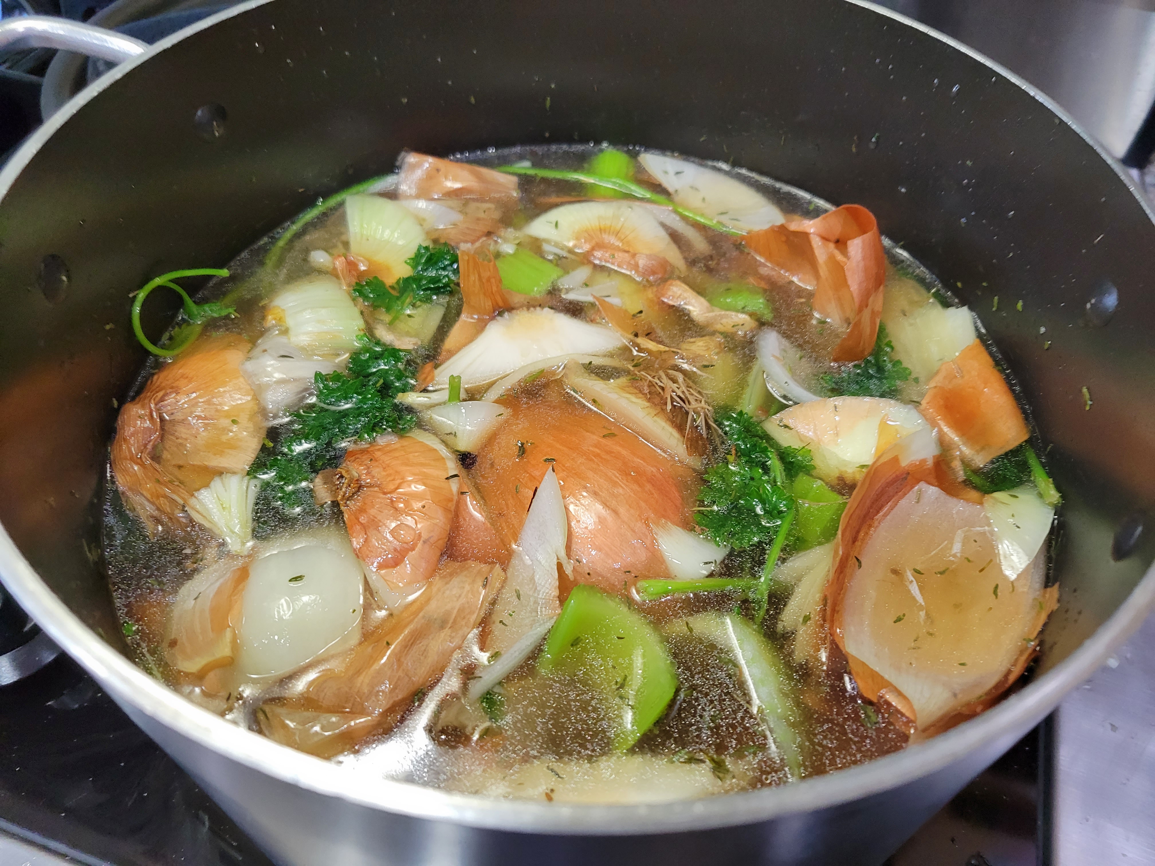 pot full of stock veggies, onion skins particularly visible