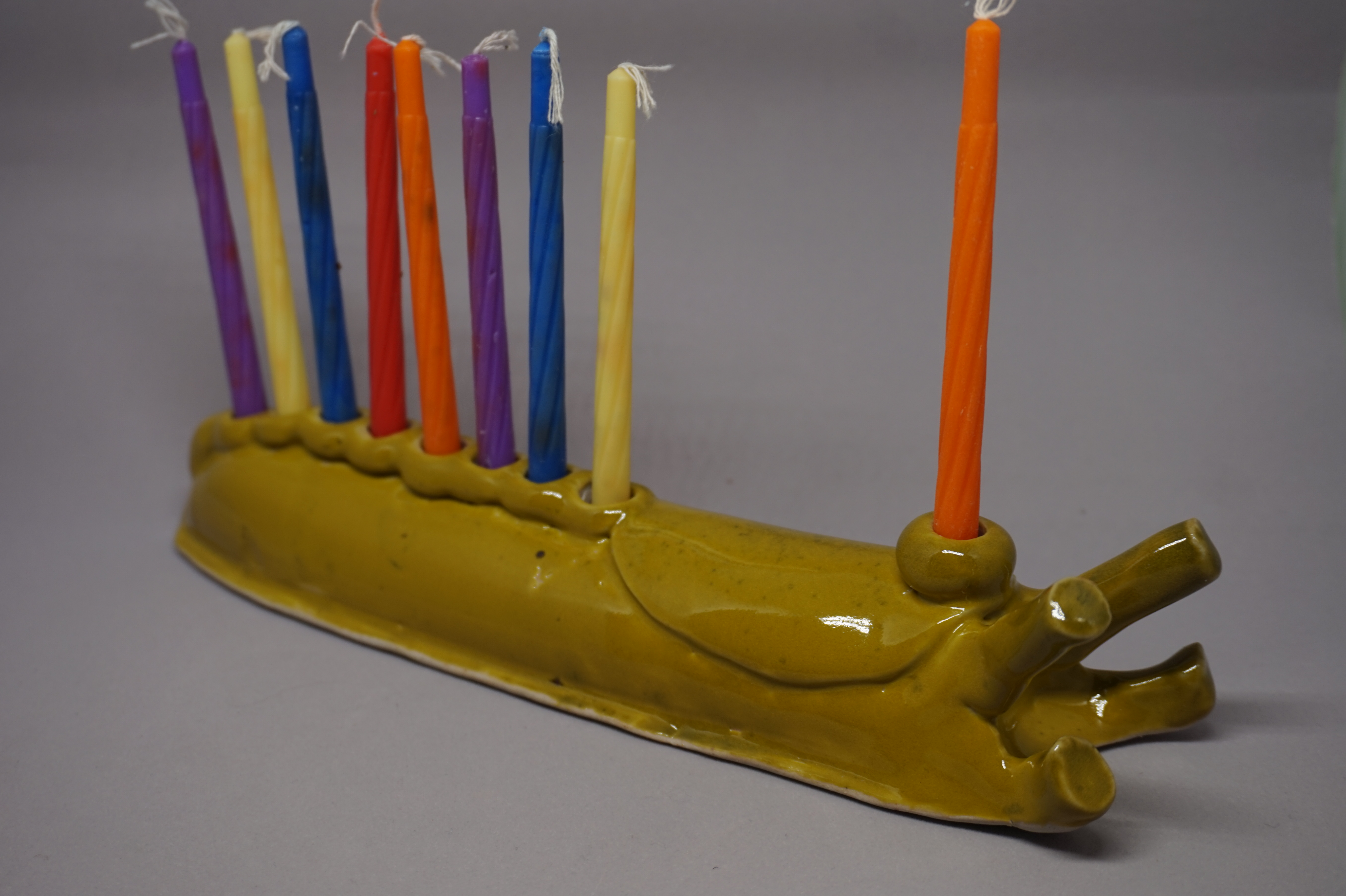 hannukkiah in the shape of a giant yellow slug