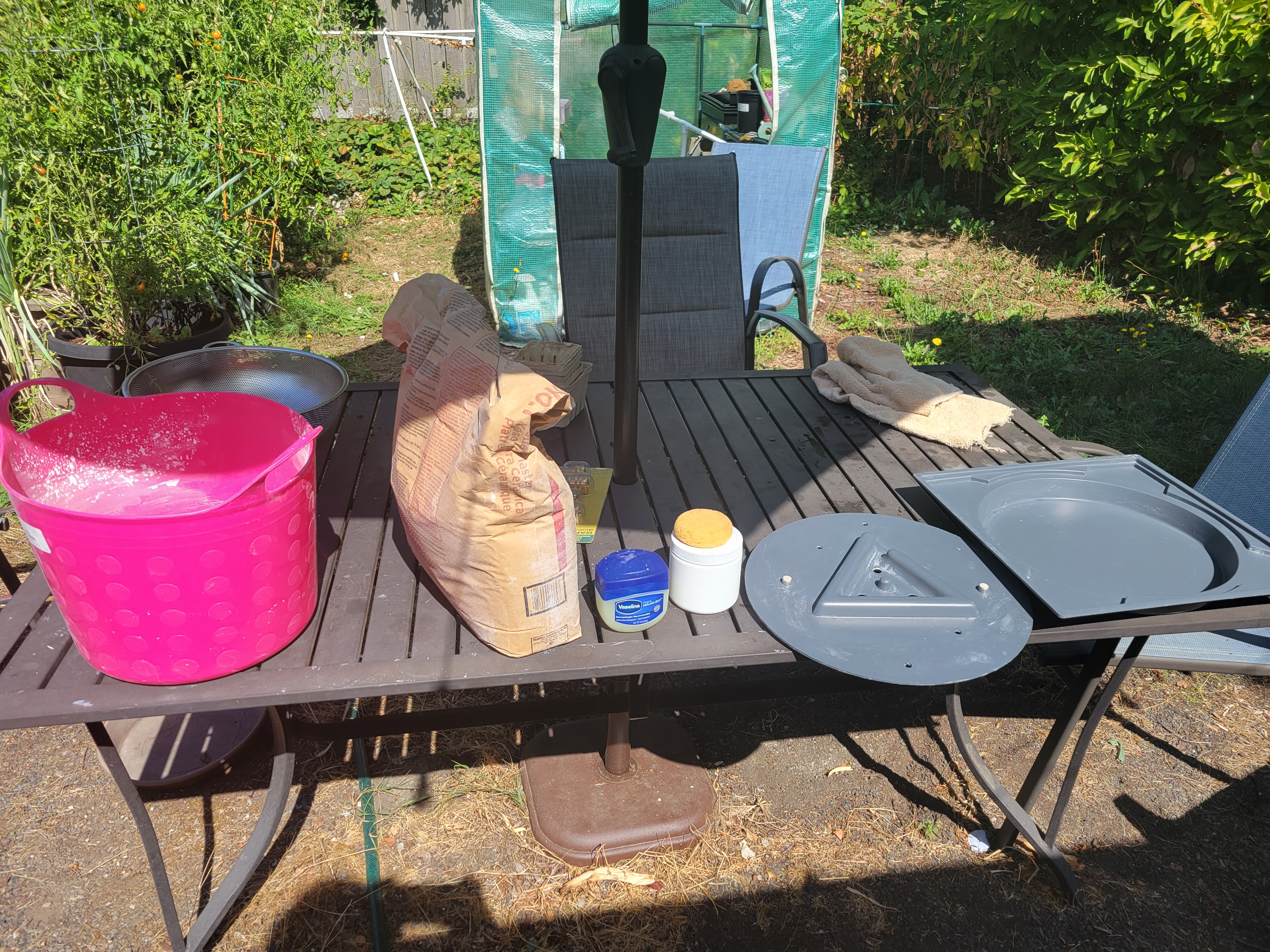 more bat-making equipment, including a P&S bat mold, mold soap, vasaline, bag of plaster, and the feed bucket again